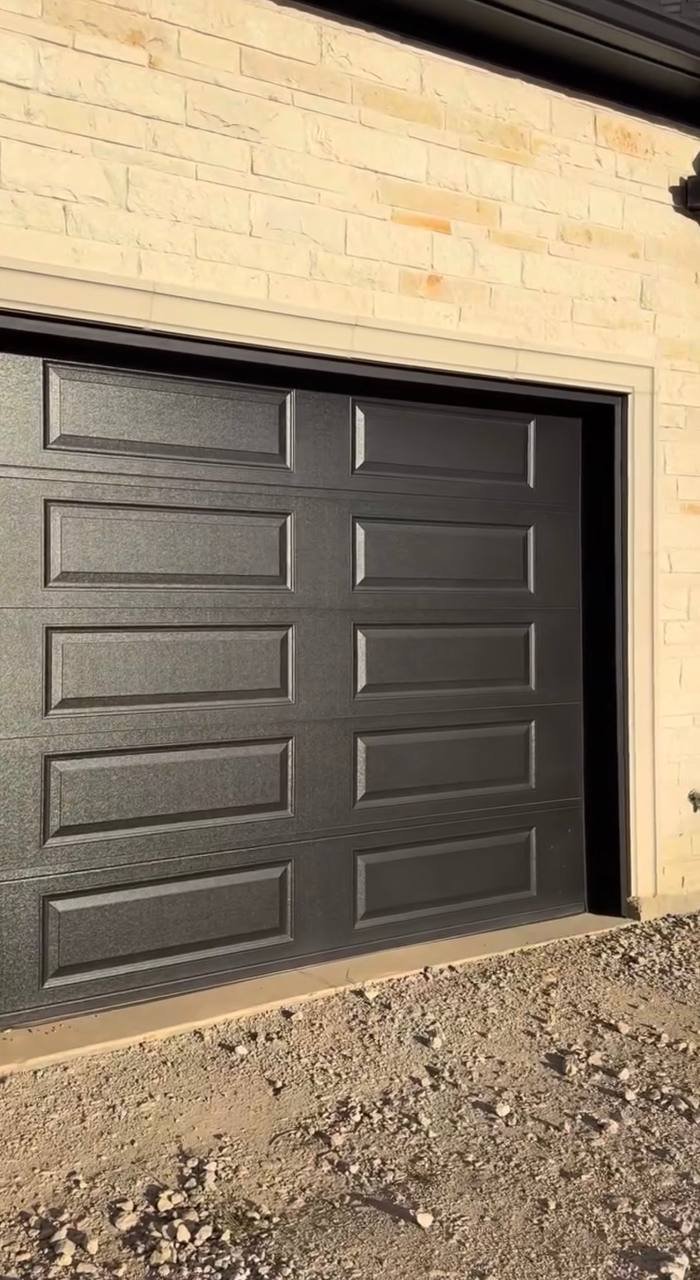 Garage door after: graphite finish with trim painted black