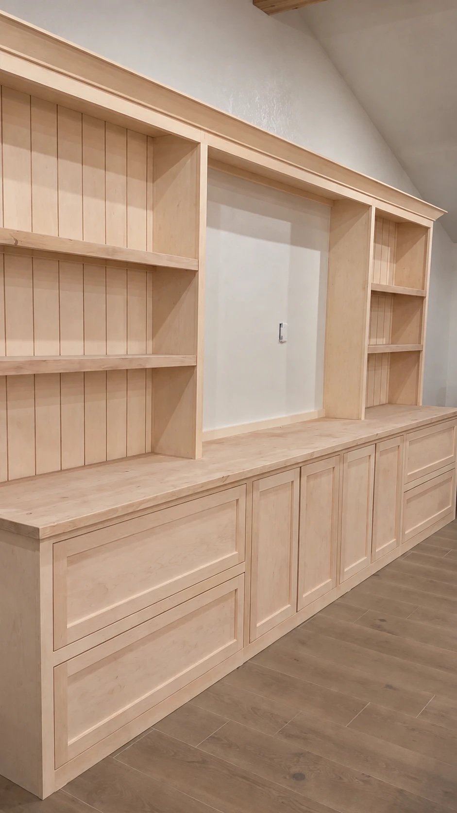 Built-in shelves before: raw unfinished wood